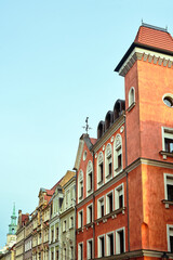 Fototapeta na wymiar fragment of the facade of historic tenement houses