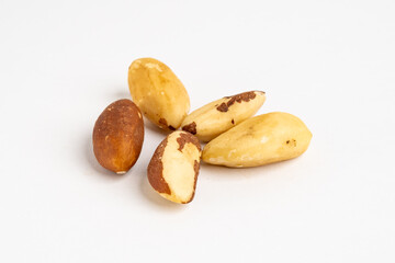 Group of raw organic brazil nut (Bertholletia excelsa) without salt on neutral grey background close up detail