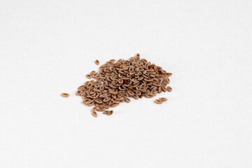 Heap of raw organic flea seeds close up detail on neutral background