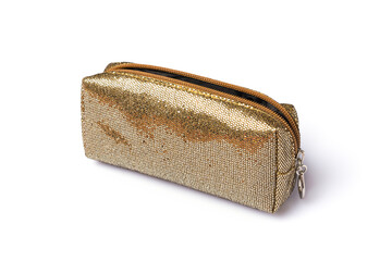Shiny golden cosmetic bag on white