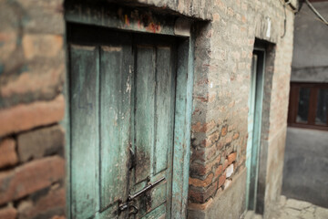 Fototapeta na wymiar Rustic wooden closed door in Kathmandu, Nepal