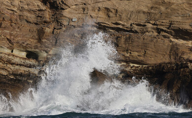 Wave hitting rocks 