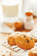 Choco cookies with making products on table.