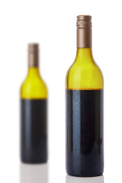 Bottles of red wine on white background.