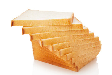 The cut loaf of white bread with reflection on white