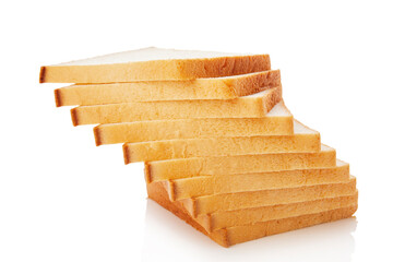 The cut loaf of white bread with reflection on white