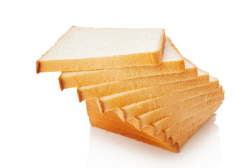 The cut loaf of white bread with reflection on white