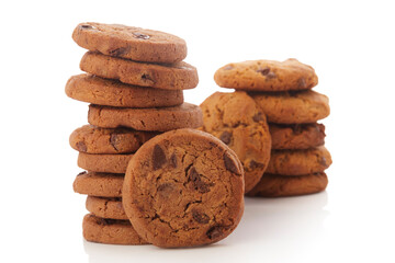 Stack of Chocolate chip cookies on white.