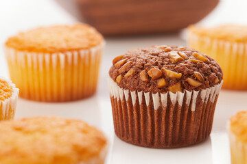 Verity of muffins on white background.