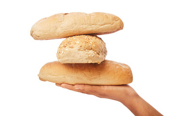 Hand holds a long loaf of breads on white.