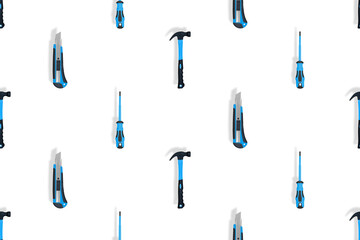 Tools seamless pattern. Tools: hammer, screwdriver and knife on a white background.