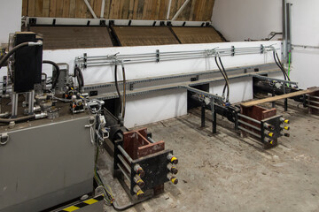 fragment of the hydraulic actuator for moving the biomass from the storage