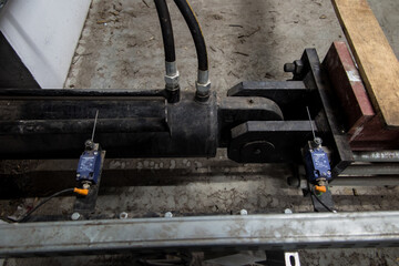 fragment of the hydraulic actuator for moving the biomass from the storage