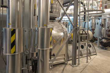 fan with a large electric motor and  ducts and pipes