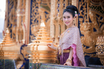 THAILAND ,Portrait of a beautiful thai woman wearing a thai dress