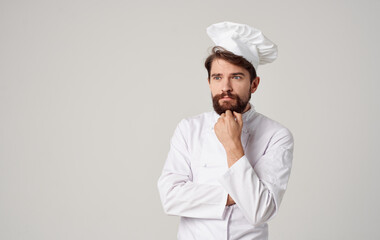 chefs in professional clothes gesturing with hands on a light background cropped view Copy Space