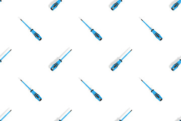 Screwdrivers seamless pattern. Metal screwdrivers with a rubberized handle on a white background.