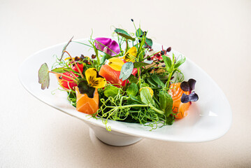 fresh salad with fish and flower petals