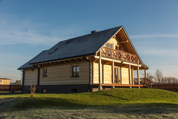Fototapeta na wymiar Log house made of fir logs