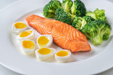 Cooked salmon with broccoli and eggs