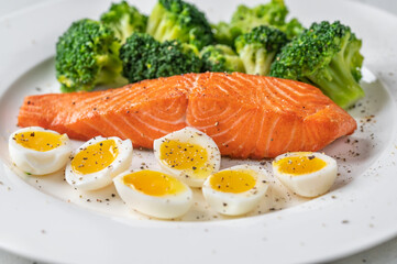 Cooked salmon with broccoli and eggs
