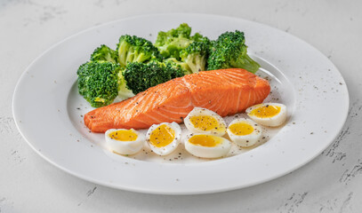 Cooked salmon with broccoli and eggs