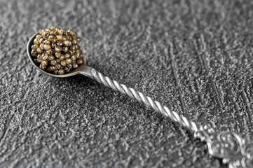 Spoon of black caviar