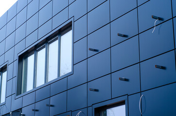 Building cladding with metal facade panels, modern material