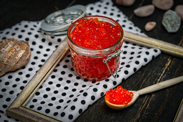 Chum salmon caviar in a glass bowl . Seafood, delicacies, healthy nutrition. 