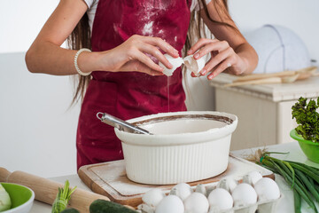 kid beating egg and flour for making dough with beater, food