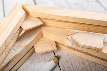 Angular connection of two pieces of wood. Making a wooden frame for a painting. Workplace carpentry workshop.