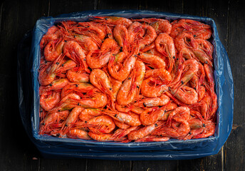 Lots of frozen prawns in a box. Seafood healthy. 