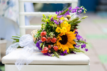Summer flower bouquet with roses and sunflower 