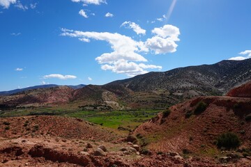 view of valley, mountains, and clouds