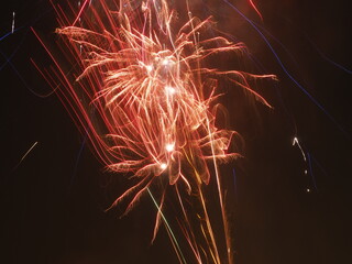 fireworks in the night sky. Colorful flashes of fire on black background. Celebration, festival or...