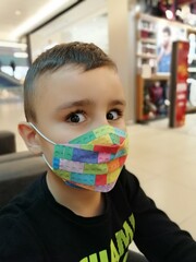 A child with a protective mask