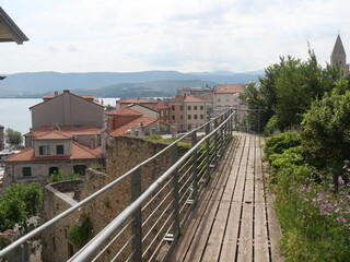 Fototapeta na wymiar Castle in Muggia : panorama on the coast from the walkway of the stone tower of the building built in a dominant position