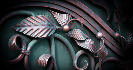 Beautiful forged leaves on a metal gate