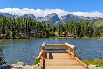 Summer Sprague Lake - A panoramic Summer view of Sprague Lake, with high peaks of Continental Divide rising at shore, Rocky Mountain National Park, Colorado, USA.