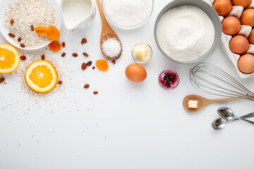 Food styling with ingredients: powder, egg, orange, salt, sugar