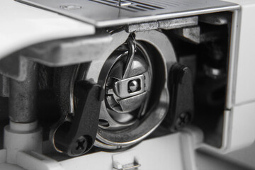 details of the sewing machine. working at home at a sewing machine.
