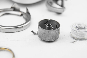 details of the sewing machine. working at home at a sewing machine.
