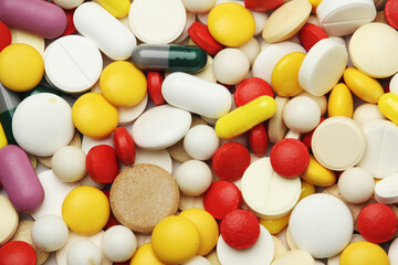 Different colorful tablets at white background