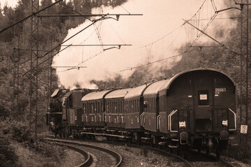 Fototapeta na wymiar Retro train is speeding on the rails