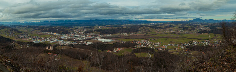 Fototapeta na wymiar Wide panorama of Sentjur pri Celju and neighbouring villages on a cloudy autumn day as seen from Rifnik mountain.