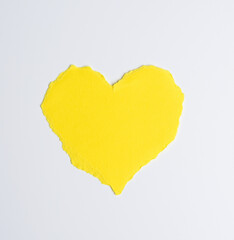 Naklejka na ściany i meble heart made of yellow paper on white background