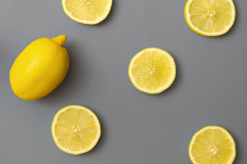 Yellow lemons on gray background. Colors of the Year 2021 Pantone Illuminating and Ultimate gray. Flat lay