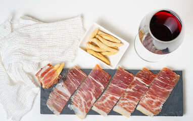 Spanish tapas, iberian loin, sausage. Iberian Acorn Ham and red wine