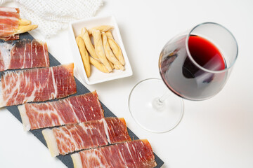 Spanish tapas, iberian loin, sausage. Iberian Acorn Ham and red wine
