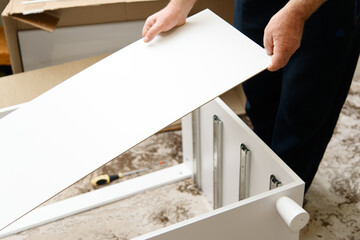 Proffecional worker collects furniture